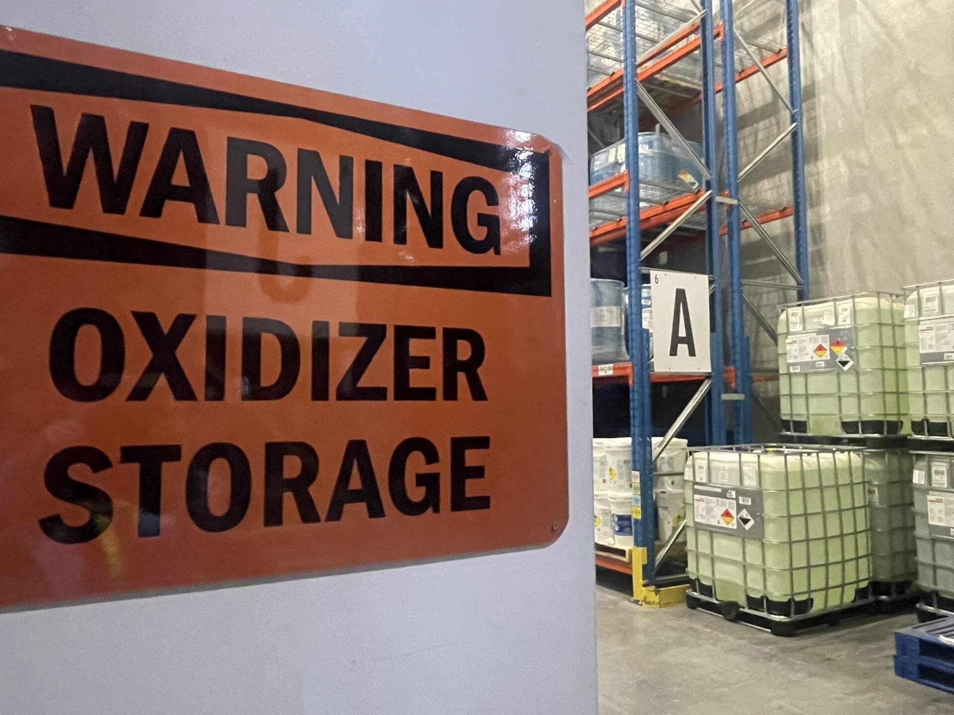 Hazardous Materials A hazardous materials sign reads: warning, oxidizer storage.